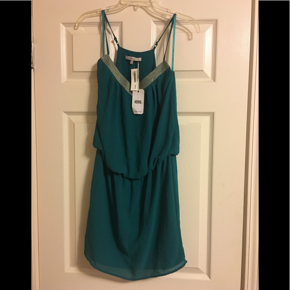 never worn still has a tag from Naked Zebra